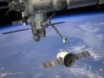 Přílet lodi Dragon k ISS v představě malíře. Foto: Spaceflightnow.com