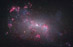 NGC 4449: Malá galaxie podrobně