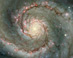 M51: Vírová galaxie vprachu a hvězdách