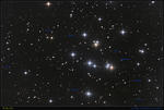 M 44 s galaktickým pozadím